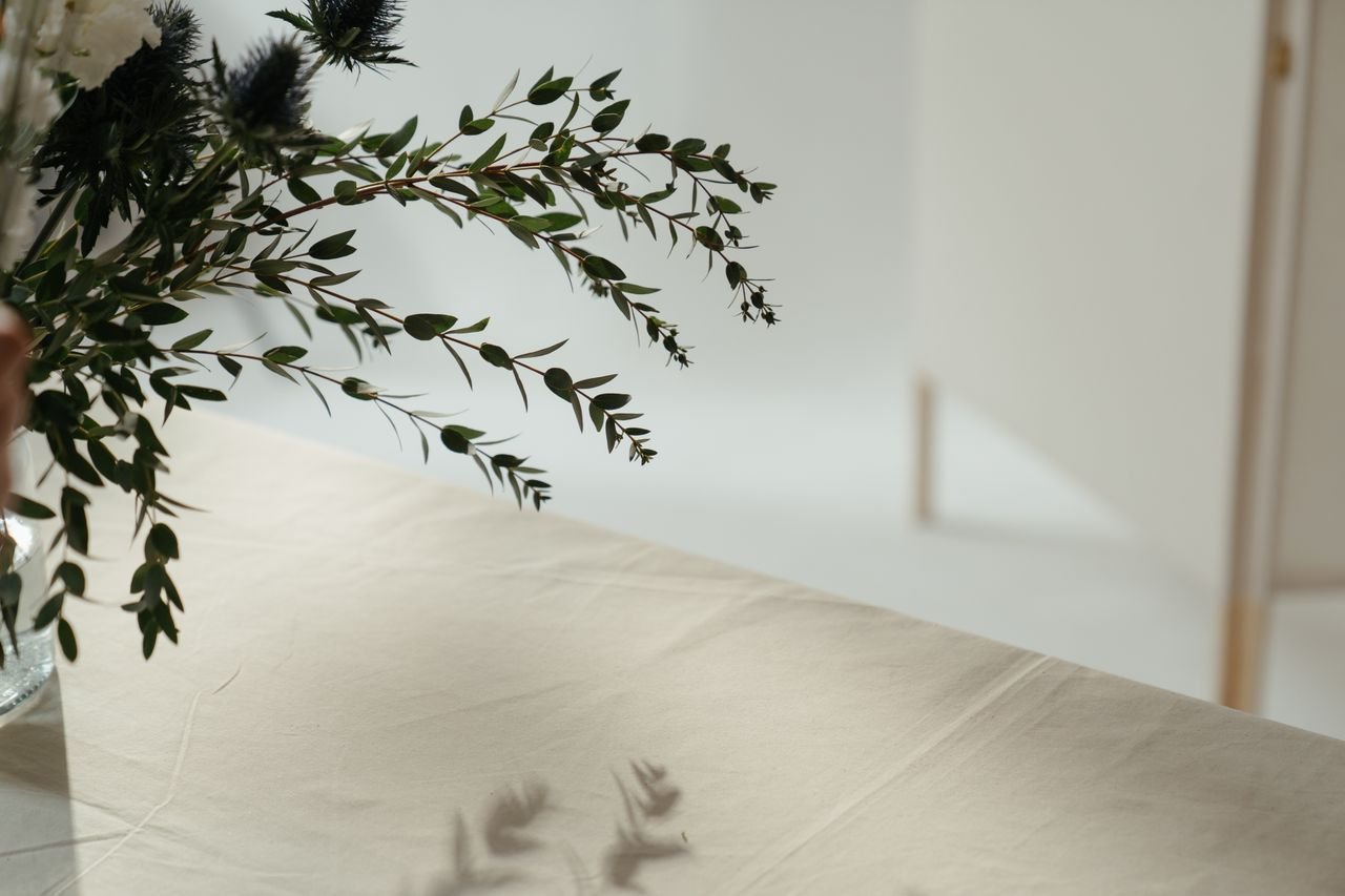 Beautiful minimalist floral arrangement on a linen tablecloth, perfect for decor inspiration.